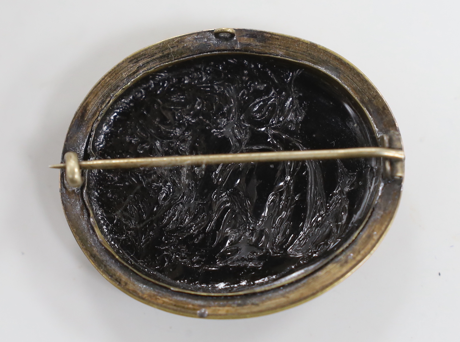 A Victorian gilt metal mounted micro mosaic oval brooch, depicting the Pantheon in Rome, 44mm.